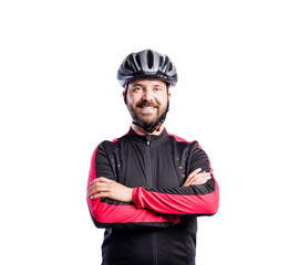 Hipster man in sports sweatshirt wearing helmet, studio shot