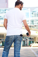 Man from behind with phone and power bank