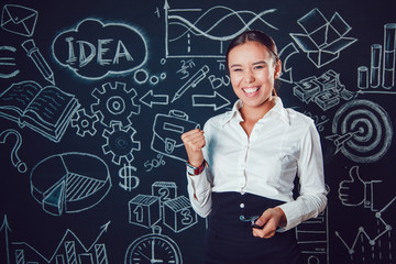 Portrait of a asian business woman standing on background with pictures and enjoys success