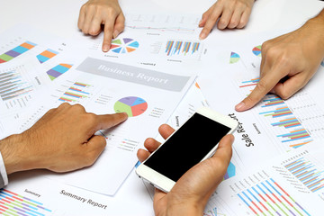 Business people hands analyst team work group during discussing financial review, business charts, point finger at graph document