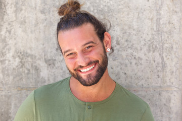 Smiling man with ponytail and beard