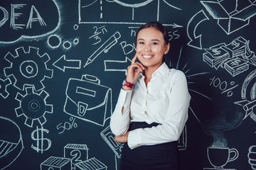 Portrait of a asian business woman standing on background with pictures