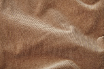 A full page of brown corduroy fabric background texture