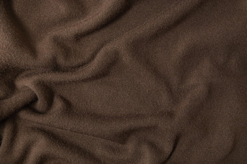 A full page of chocolate brown fine knitted background texture