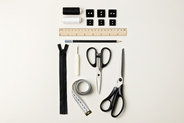 Everything for sewing in black and white. Fabric and thread, zip