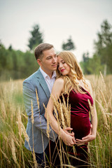Portrait loving family in anticipation of the baby. Soft and romantic in nature photography