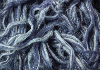 A full page of blue and white wool strands background texture