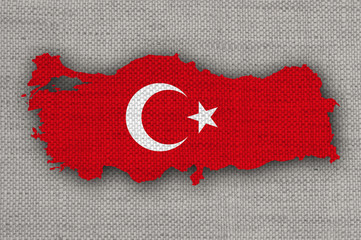 Karte und Fahne der Türkei auf altem Leinen
