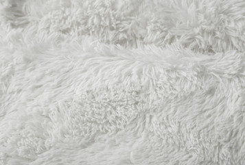 A full page of soft white faux fur fabric background texture