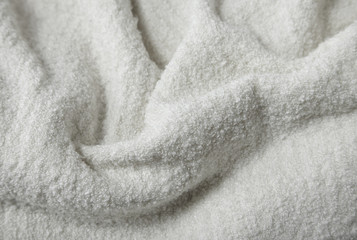 Fototapeta na wymiar A full page of soft cream sweater fabric background texture