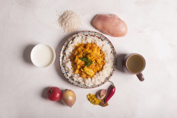 Chicken curry with rice and ingredients on the white board