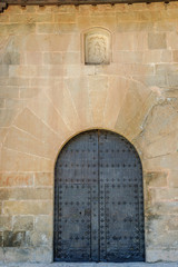 door of semicircular arch of a convent of the medieval town of Albarracin in Teruel, Aragon, Spain