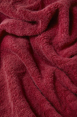 Fototapeta na wymiar A full page of soft red bath robe fabric texture