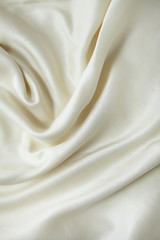 A full page of soft cream silk fabric background texture