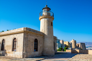 Fototapeta na wymiar View of the lighthouse and fort in Roquetas de Mar, Almeria region, Costa Tropica, Spain