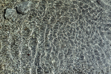 Wasser Textur hintergrund mit sonnenspiegelung