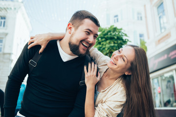 Man and woman walking on a city in Europe. Love, happiness, relationships.