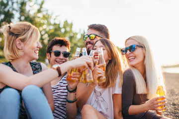 Group of friends having fun by the river 