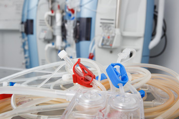 Blood tubes with hemodialysis machine in the background