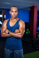 Obraz na płótnie Canvas Confident athlete standing in gym