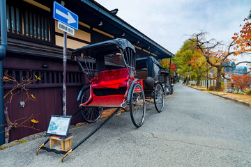 Japanese rickshaw or old style two wheeled passenger cart in Tak - obrazy, fototapety, plakaty