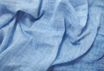 A full page of soft blue linen fabric background texture 