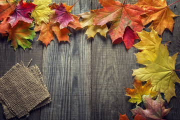 Naklejka na ściany i meble autumn background with spices, orange leaf on old grunge wood de
