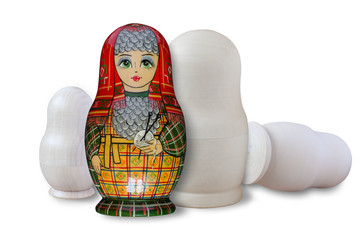 Matryoshka. Painted and unpainted. Isolated on white