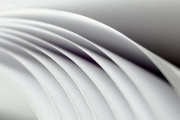 curved sheets of white paper