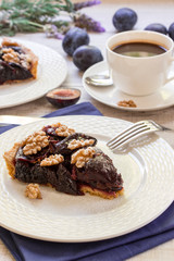 Piece of plum cake with coffee.