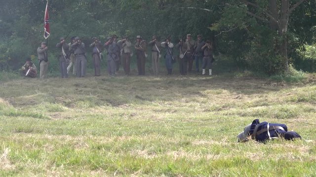 Union soldiers firing across battlefield