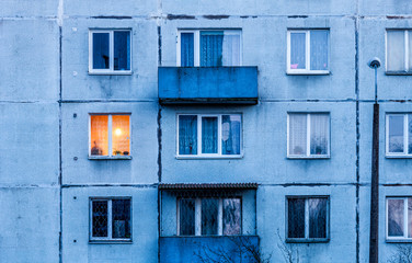 Wall with Iluminated window. Detail of soviet era block apartment building