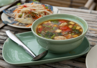 Colorful Thailand seafood salad with freshly-caught seafood and vegetables made at authentic Thai seafood restaurant on Koh Samet island in the Gulf of Thailand.