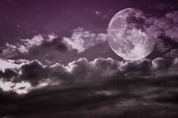 Vintage cloudy sky with full moon. Moon image courtesy NASA.