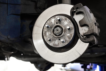 The image of a calliper disk brake close up