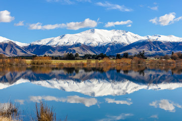 Fototapeta na wymiar Reflection of snowy mountains near Fairlie, New Zealand