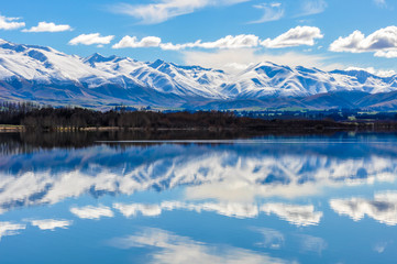 Fototapeta premium Reflection of snowy mountains near Fairlie, New Zealand
