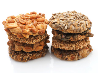 Tasty cookies with sesame and sunflower seeds isolated on white background