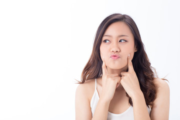 Fototapeta premium An Asian pretty clean face girl making funny face showing her skin