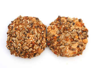 Tasty cookies with sesame and sunflower seeds isolated on white background