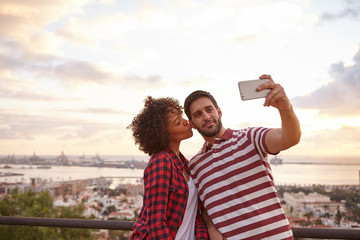 Couple taking selfie with a cellphone