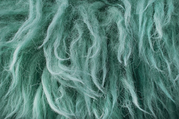 A full page close up of green furry background texture