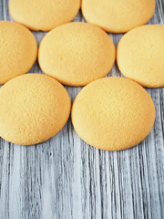 Tasty biscuits on the wooden background