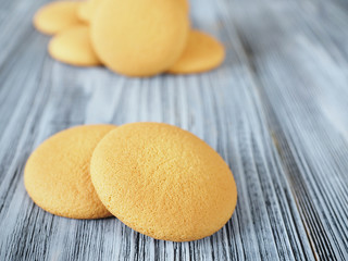Tasty biscuits on the wooden background