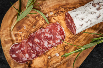 Salami on dark background