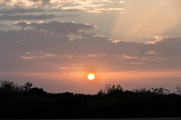 Fototapeta premium Sunset with clouds, light rays