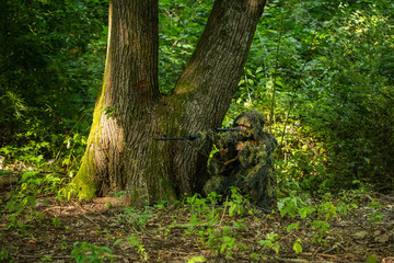 Sniper in ghillie suit