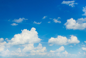 white fluffy clouds in the blue sky