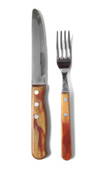 A knife and fork with wooden handles isolated on a white background