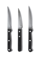 Assorted black and silver steak knives isolated on a white background